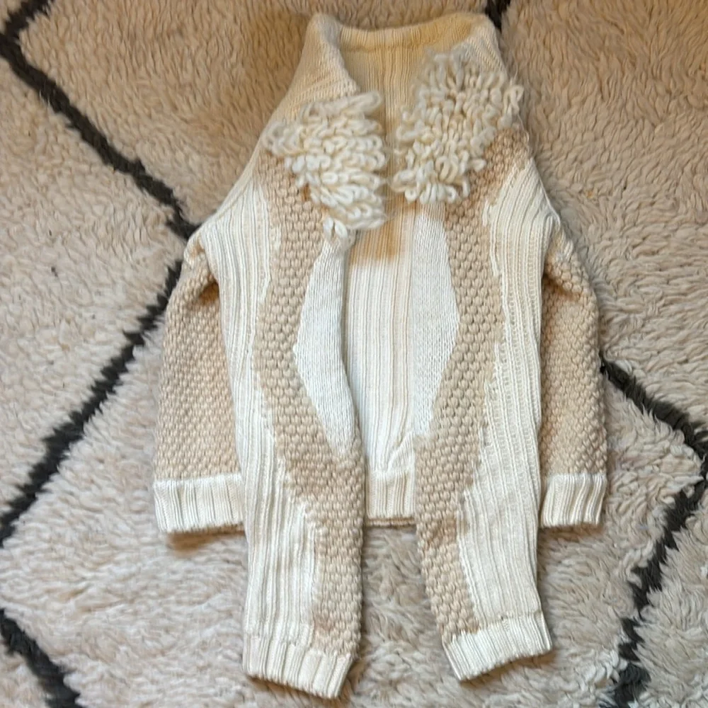 Elegant Cream Sweater with Textured Sleeves
